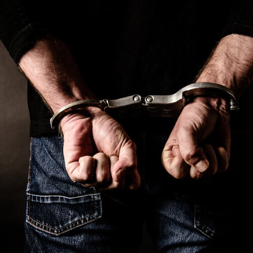 close-up of an individual in handcuffs